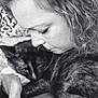 Spice joined the competition — help win amazing prizes! black_and_gray_cat, cat, woman, face, close_up, cuddling, affection, curly_hair, bedspread, patterned_background, indoor, pet, portrait, snuggling, resting_cat, monochrome, black_and_white, human_animal_bond, comfort, intimacy