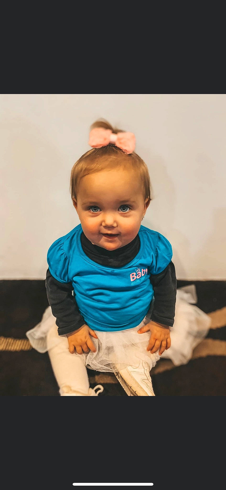 Savannah joined the competition — help win amazing prizes! arm, baby, baby_toddler_clothing, cheek, child, couch, elbow, electric_blue, eye, face, flash_photography, floor, flooring, gesture, happy, person, sitting, skin, sleeve, t_shirt