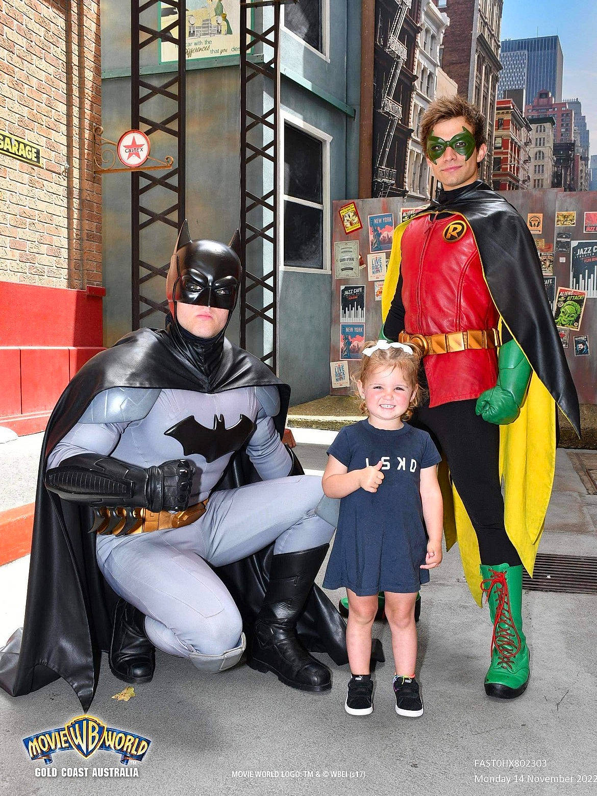 Willoh is registered to the contest to win money with this photo: armour, avengers, boot, building, captain_america, costume, event, eyewear, fiction, fictional_character, fun, hat, headwear, hero, joy, justice_league, person, personal_protective_equipment, shield, shoe