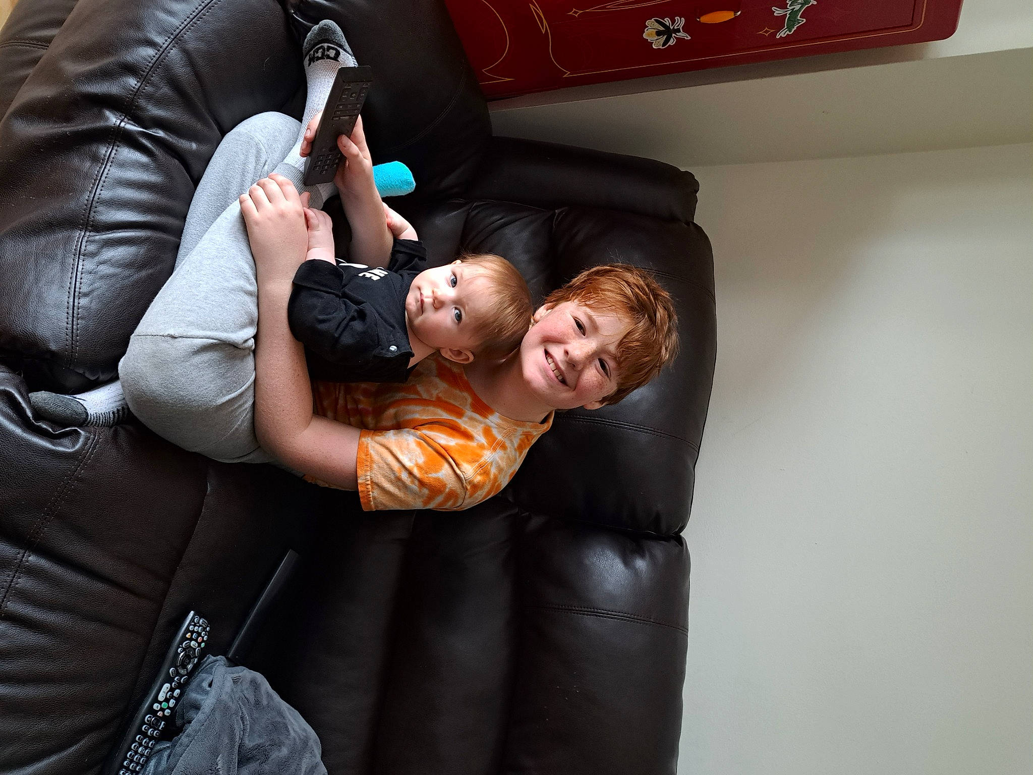 Damian joined the competition — help win amazing prizes! baby, baby_products, child, comfort, couch, flash_photography, fun, gesture, happy, human_leg, joy, lap, leisure, luxury_vehicle, person, room, shoe, sitting, smile, suit