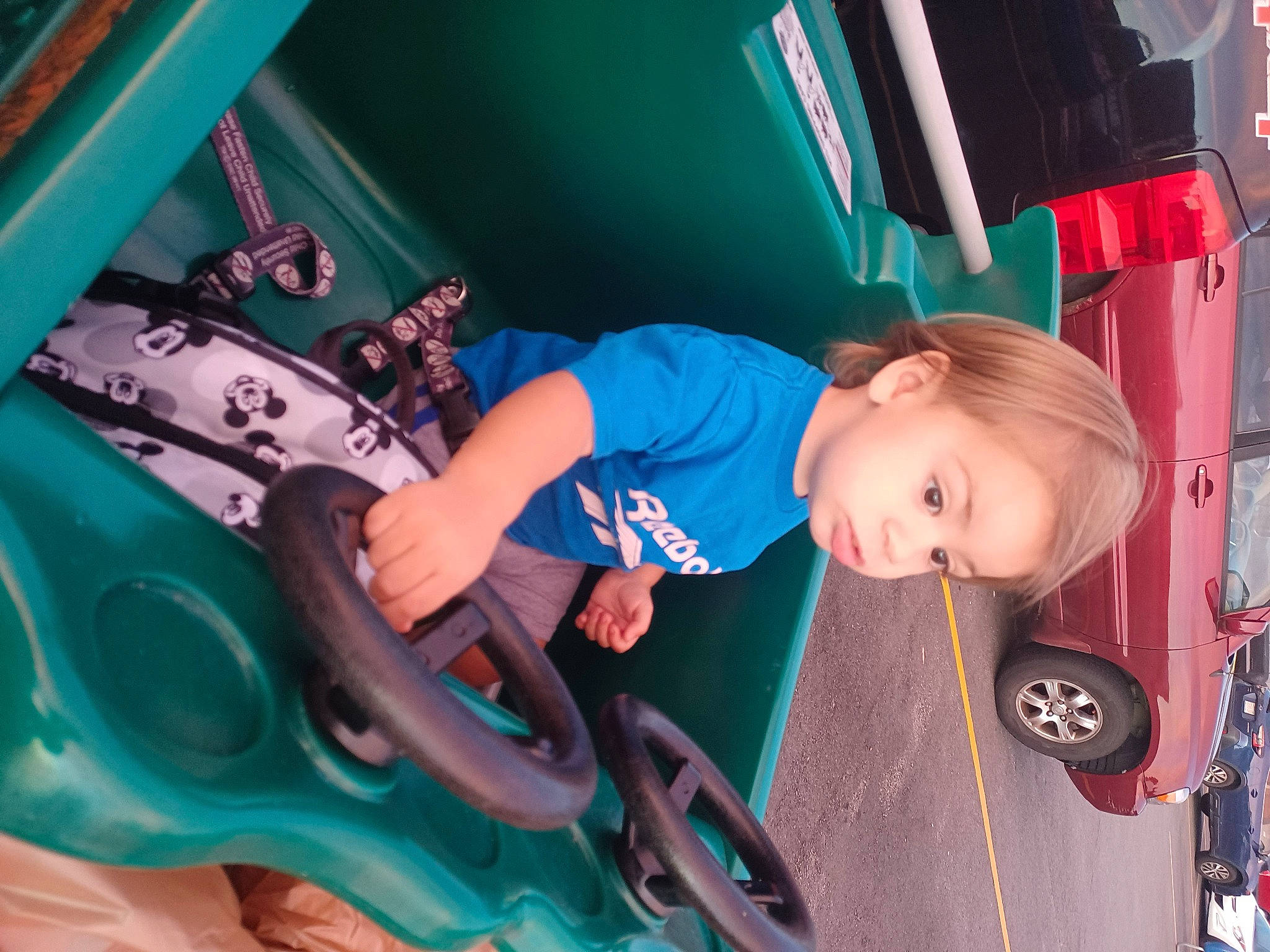 Alexi is registered to the contest to win money with this photo: auto_part, automotive_design, automotive_exterior, automotive_tire, baby_toddler_clothing, bumper, child, electric_blue, fender, fun, leisure, motor_vehicle, person, recreation, snapshot, t_shirt, tire, toddler, vehicle, vehicle_door