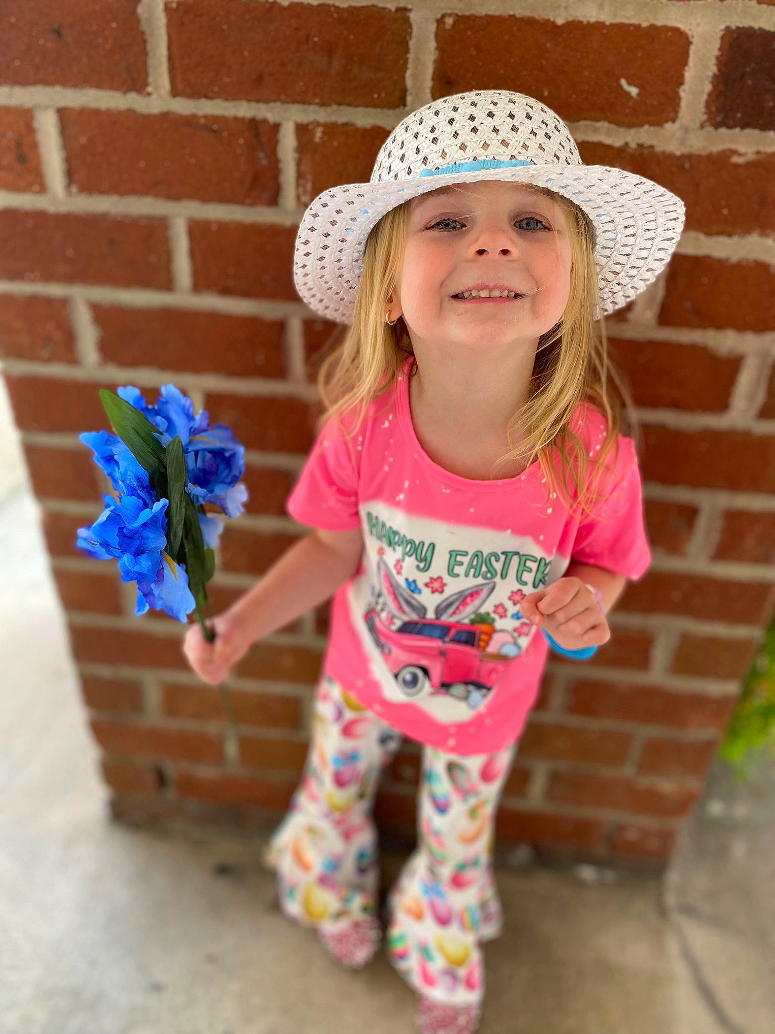 Mackena joined the competition — help win amazing prizes! baby_toddler_clothing, brick, brickwork, clothing, face, facial_expression, fun, grass, happy, hat, headwear, joy, people, person, pink, plant, sleeve, smile, summer, sun_hat