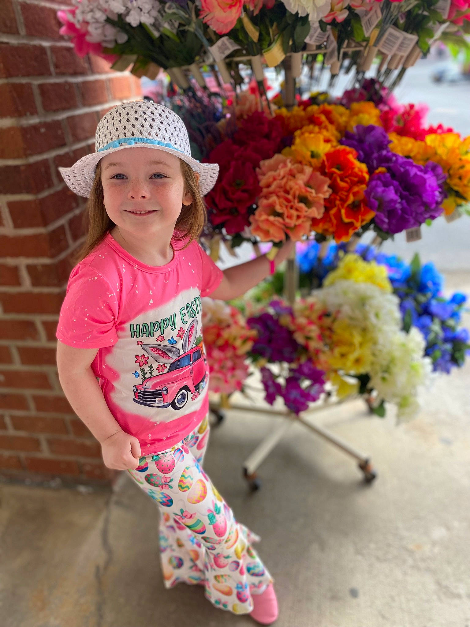 Paislee joined the competition — help win amazing prizes! baby_toddler_clothing, cap, facial_expression, fashion, flower, fun, happy, hat, headgear, headwear, joy, leisure, magenta, person, pink, plant, public_space, recreation, sleeve, smile