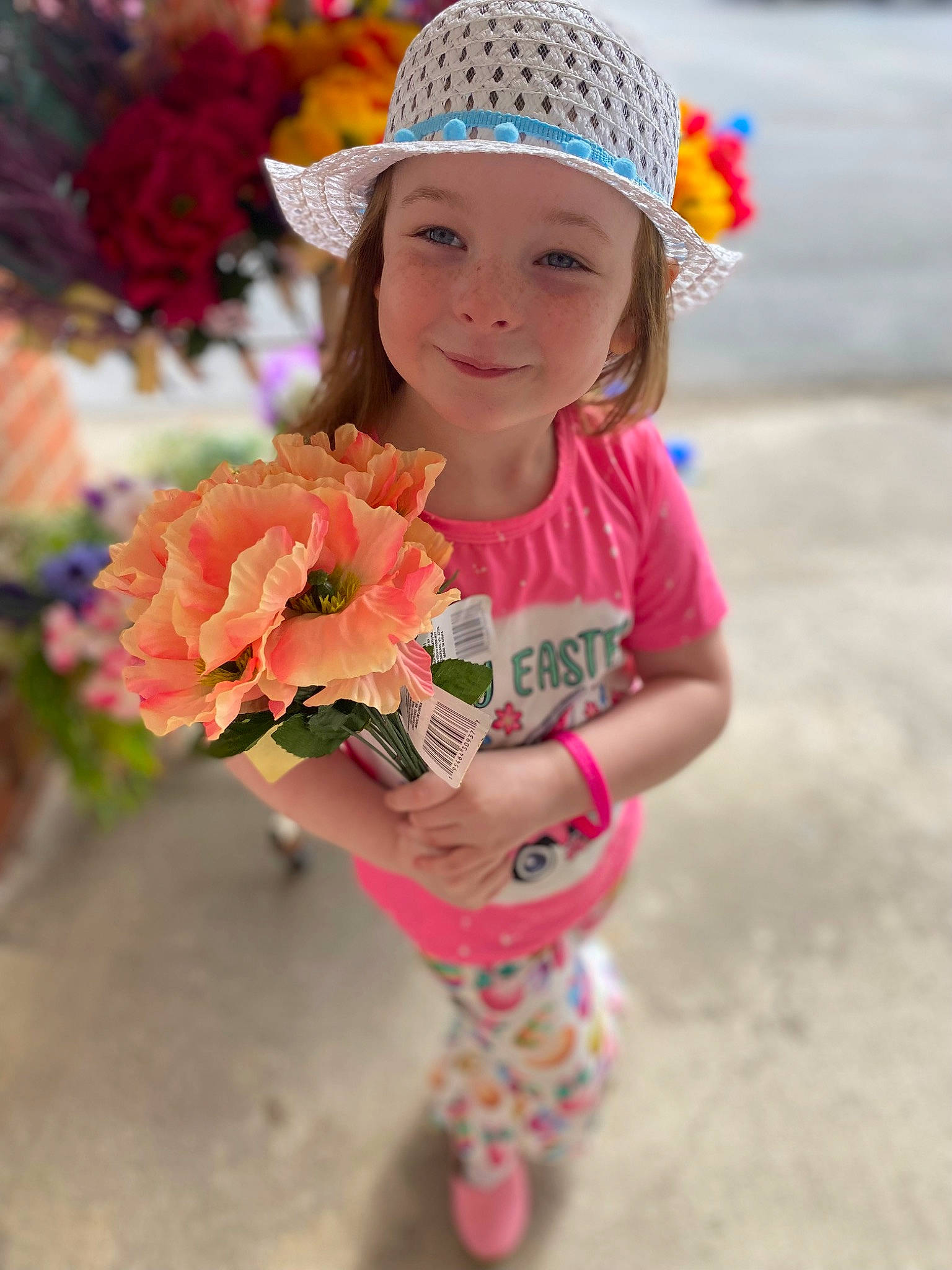 Paislee joined the competition — help win amazing prizes! cap, child, event, eye, face, fashion_accessory, flower, fun, happy, hat, head, headgear, headwear, joy, knit_cap, magenta, person, petal, pink, plant