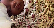 Amina joined the competition — help win amazing prizes! baby, blanket, bottle, child, closeup, cozy, cute, face, floral_pattern, indoors, infant, newborn, nursery, peaceful, portrait, resting, sleeping, soft_lighting, swaddled, tender_moment