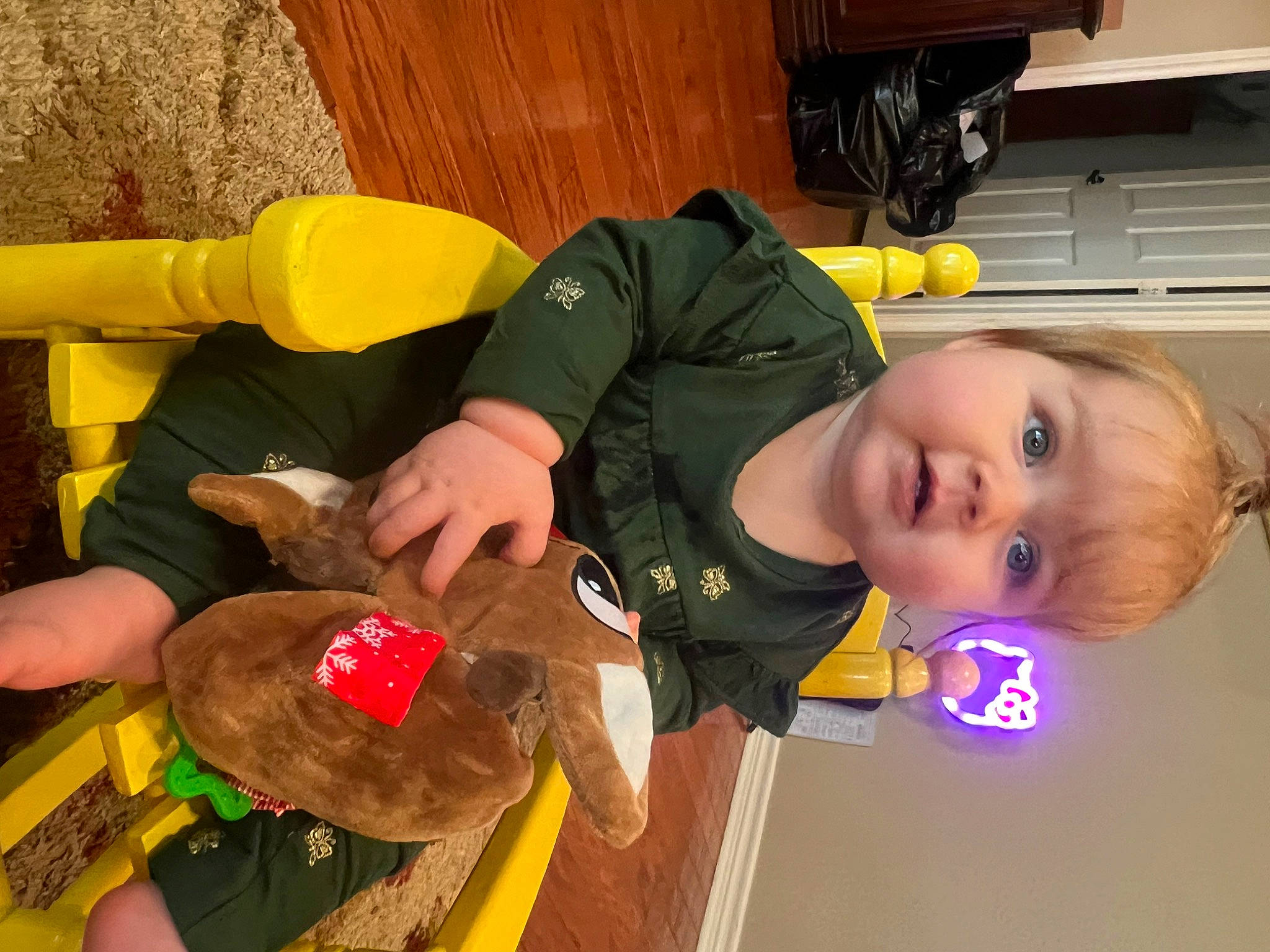 Indie is registered to the contest to win money with this photo: baby, baby_products, baby_toddler_clothing, baby_toys, child, flooring, fun, person, play, room, smile, toddler, wrist, yellow