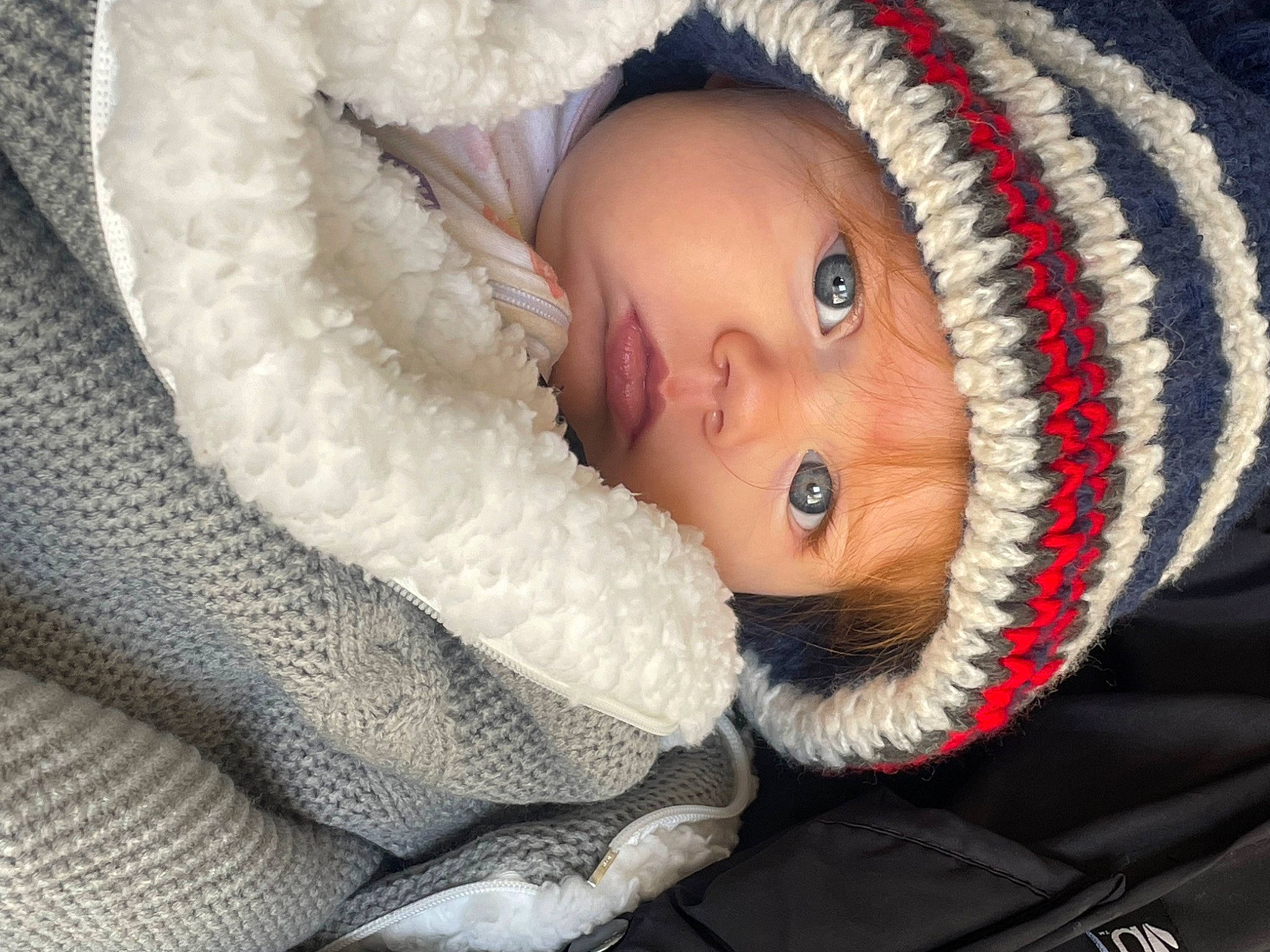 Indie is registered to the contest to win money with this photo: baby, baby_products, baby_sleeping, baby_toddler_clothing, beanie, cap, cheek, child, comfort, eye, fashion_accessory, fur, headwear, human_body, iris, knit_cap, linens, person, textile, toddler