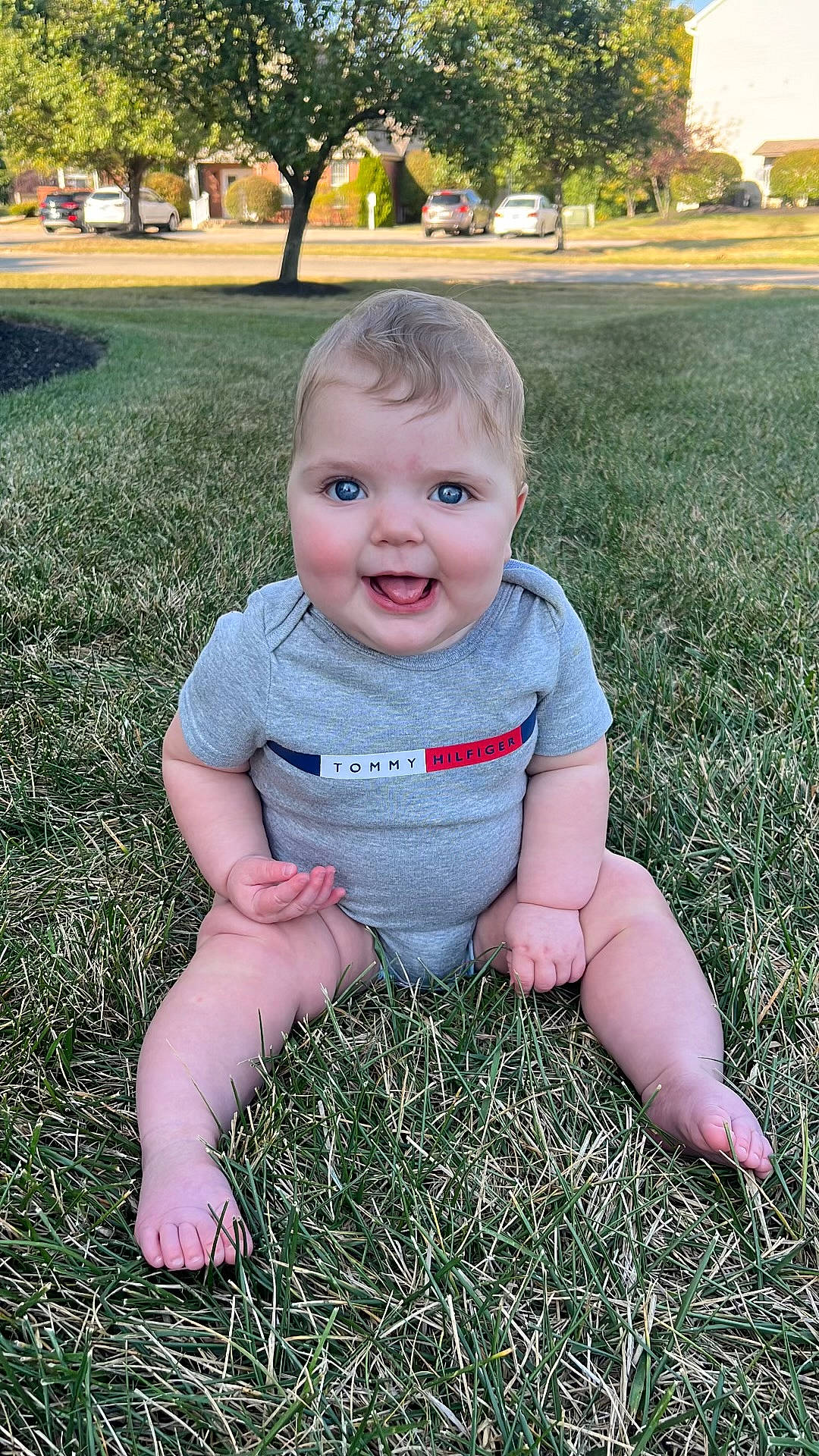 Delanie joined the competition — help win amazing prizes! baby, baby_toddler_clothing, botany, child, facial_expression, fun, grass, grass_family, happy, joy, lawn, leaf, people_in_nature, person, plant, skin, smile, standing, summer, toddler