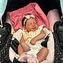 baby, infant, car_seat, blanket, headband, pink, sleeping, clothing, footwear, strap, child, newborn, cute, soft, rest, indoors, comfort, accessory, seat, peaceful