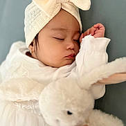 Mihaela Angelique joined the competition — help win amazing prizes! baby, sleeping, headband, bow, white_clothing, plush_toy, bunny, soft_toy, child, peaceful, closeup, portrait, adorable, cute, resting, infant, indoor, comfort, soft_texture, cuddle