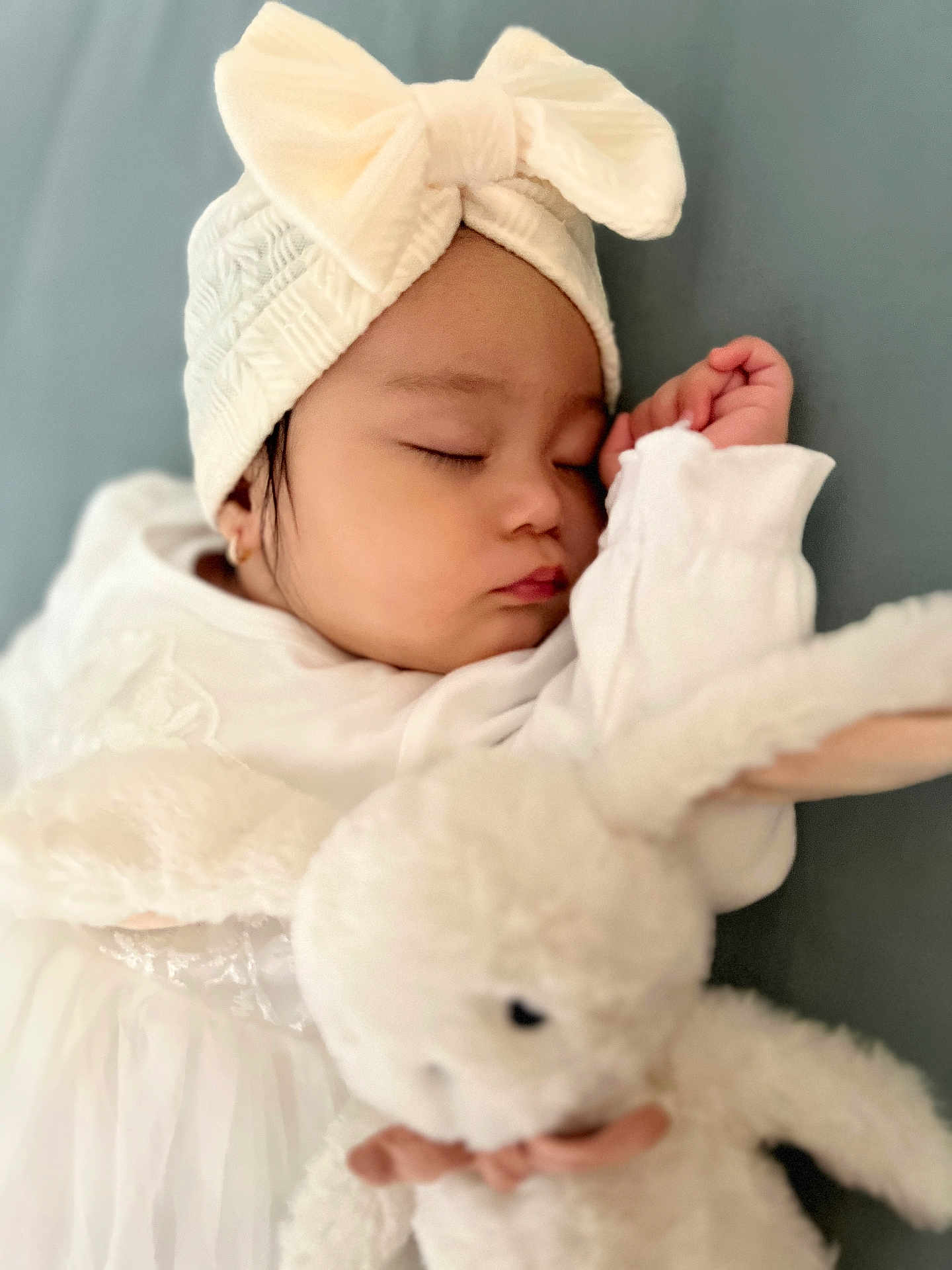 Mihaela Angelique joined the competition — help win amazing prizes! baby, sleeping, headband, bow, white_clothing, plush_toy, bunny, soft_toy, child, peaceful, closeup, portrait, adorable, cute, resting, infant, indoor, comfort, soft_texture, cuddle