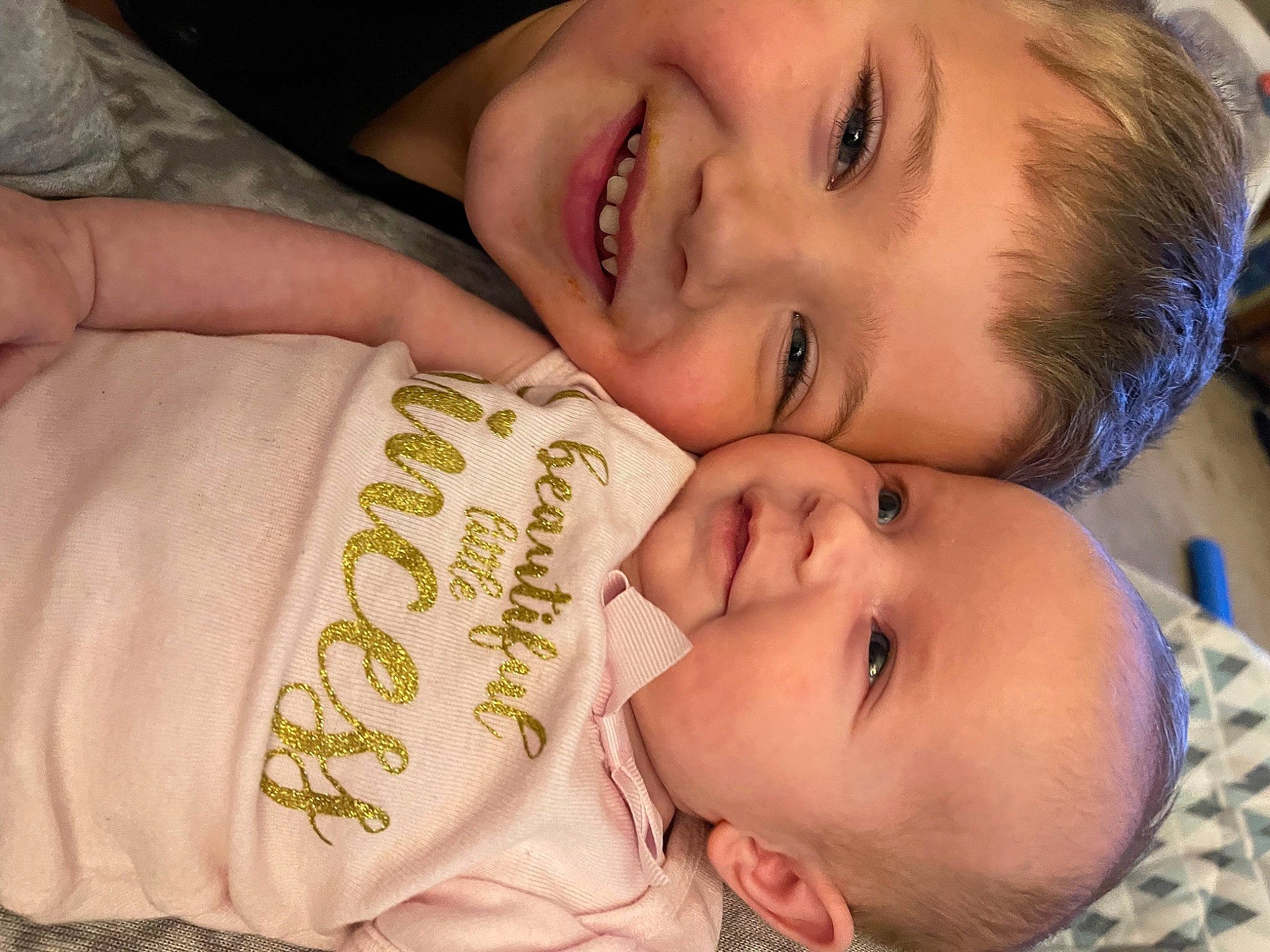 Tanner is registered to the contest to win money with this photo: baby_toddler_clothing, cheek, chin, eye, eyebrow, eyelash, face, facial_expression, finger, forehead, gesture, happy, iris, joy, lip, mouth, nose, organ, person, product