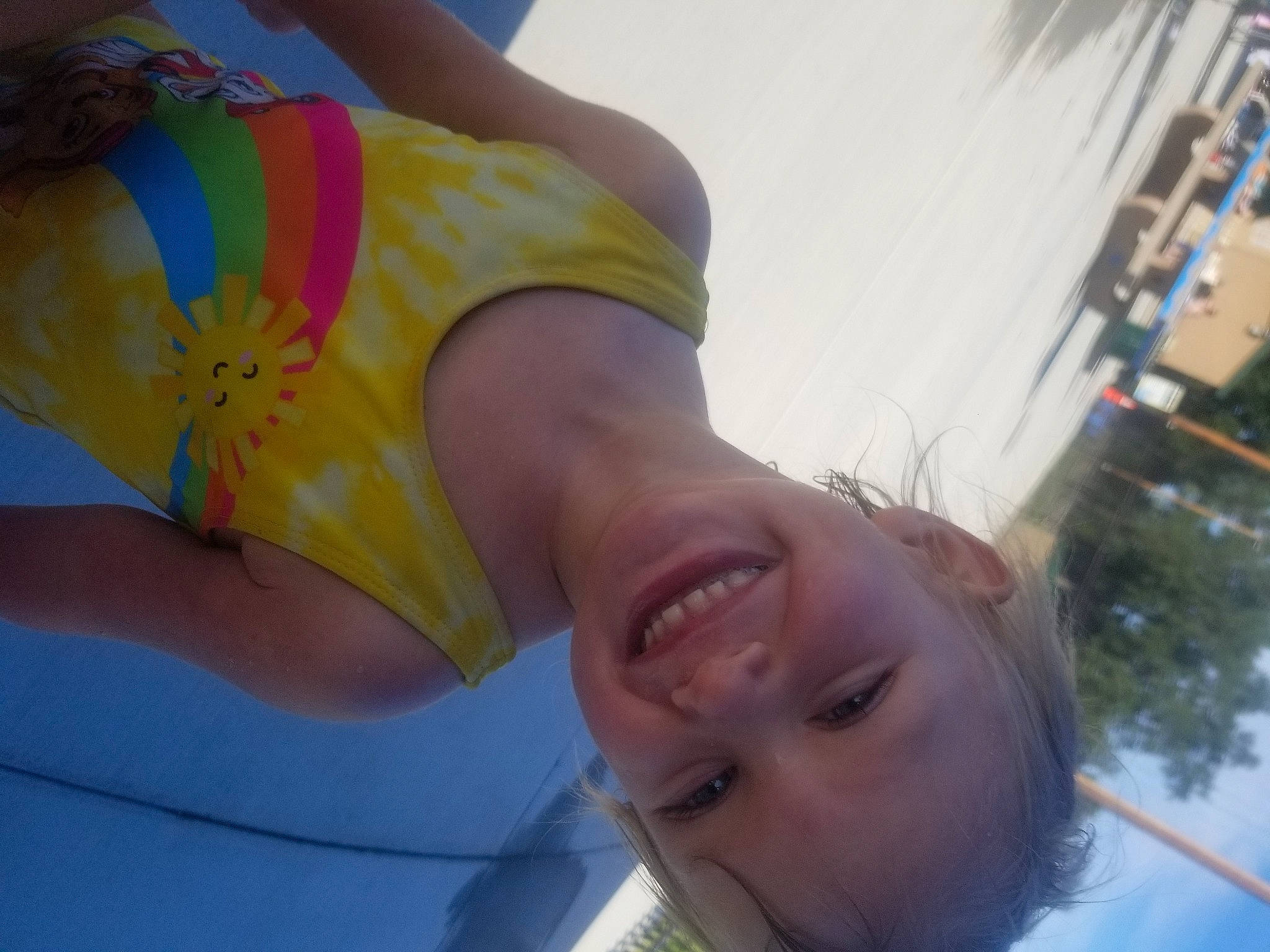 Justice is registered to the contest to win money with this photo: chest, dress, elbow, eyewear, fun, gesture, grass, happy, joy, knee, leisure, neck, person, plant, skin, sky, smile, thigh, tree, trunk