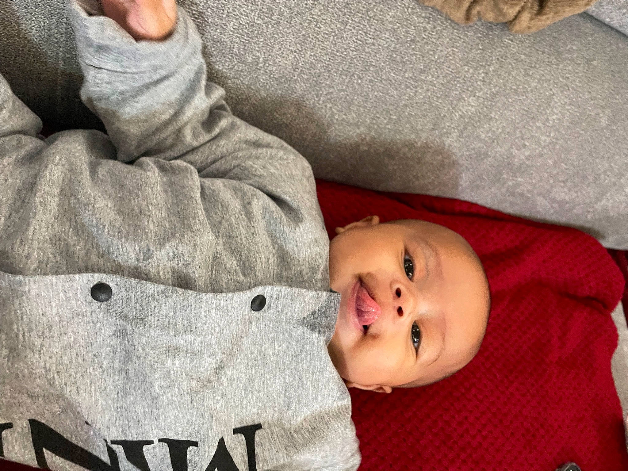 Ezra participe au concours pour gagner de l'argent avec cette photo : baby, baby_toddler_clothing, carmine, cheek, child, comfort, face, fur, hat, headwear, linens, nose, pattern, person, portrait_photography, sitting, skin, sleeve, textile, toddler