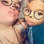 Abel is registered to the contest to win money with this photo: child, adult, selfie, filter, bear_ears, glasses, tattoo, necklace, closeup, indoor, person, cute, expression, playful, face, head, smile, holding, striped_clothing, jewelry