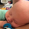 baby, sleeping, pacifier, close_up, infant, head, skin, child, indoors, resting, peaceful, cute, small, wearing, clothing, person, human, relaxing, face, newborn