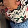 newborn, baby, swaddled, blanket, footprints, tattoo, arm, sleeping, infant, closeup, skin, person, cozy, warm, soft, peaceful, cute, wrapped, portrait, child
