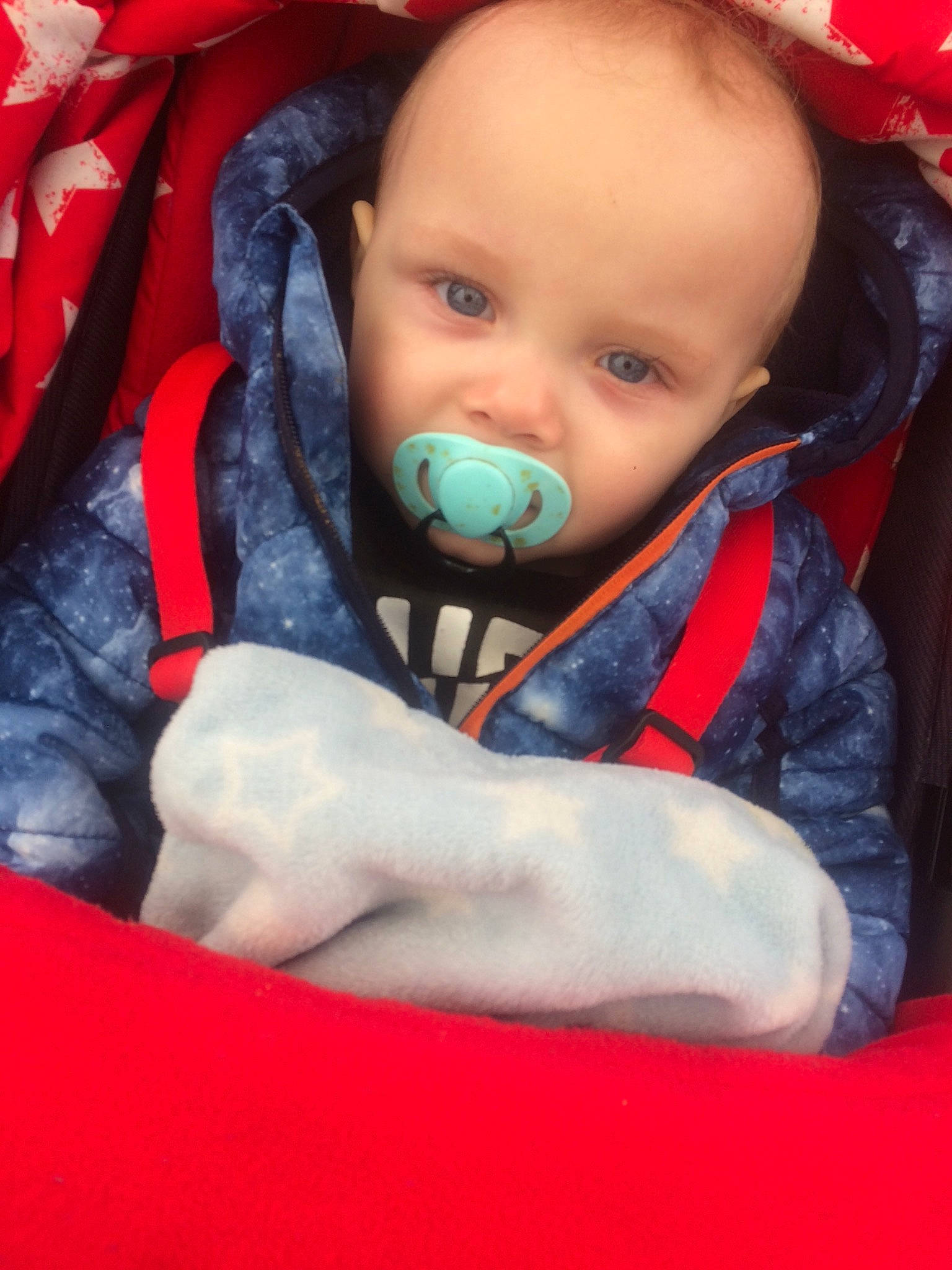 Isaac is registered to the contest to win money with this photo: cheek, child, finger, fun, head, infant, lip, mouth, nose, person, play, product, red, skin, smile, textile, toddler