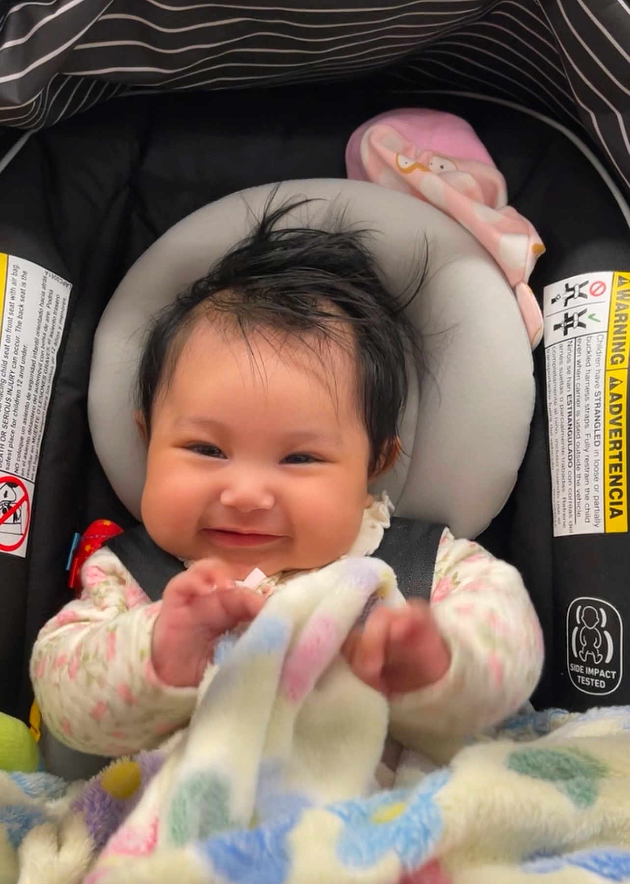 Amara joined the competition — help win amazing prizes! baby, smiling, car_seat, blanket, infant, child, happy, face, clothing, seatbelt, toddler, indoors, cute, headrest, safety, soft_toy, warm, portrait, person, hair
