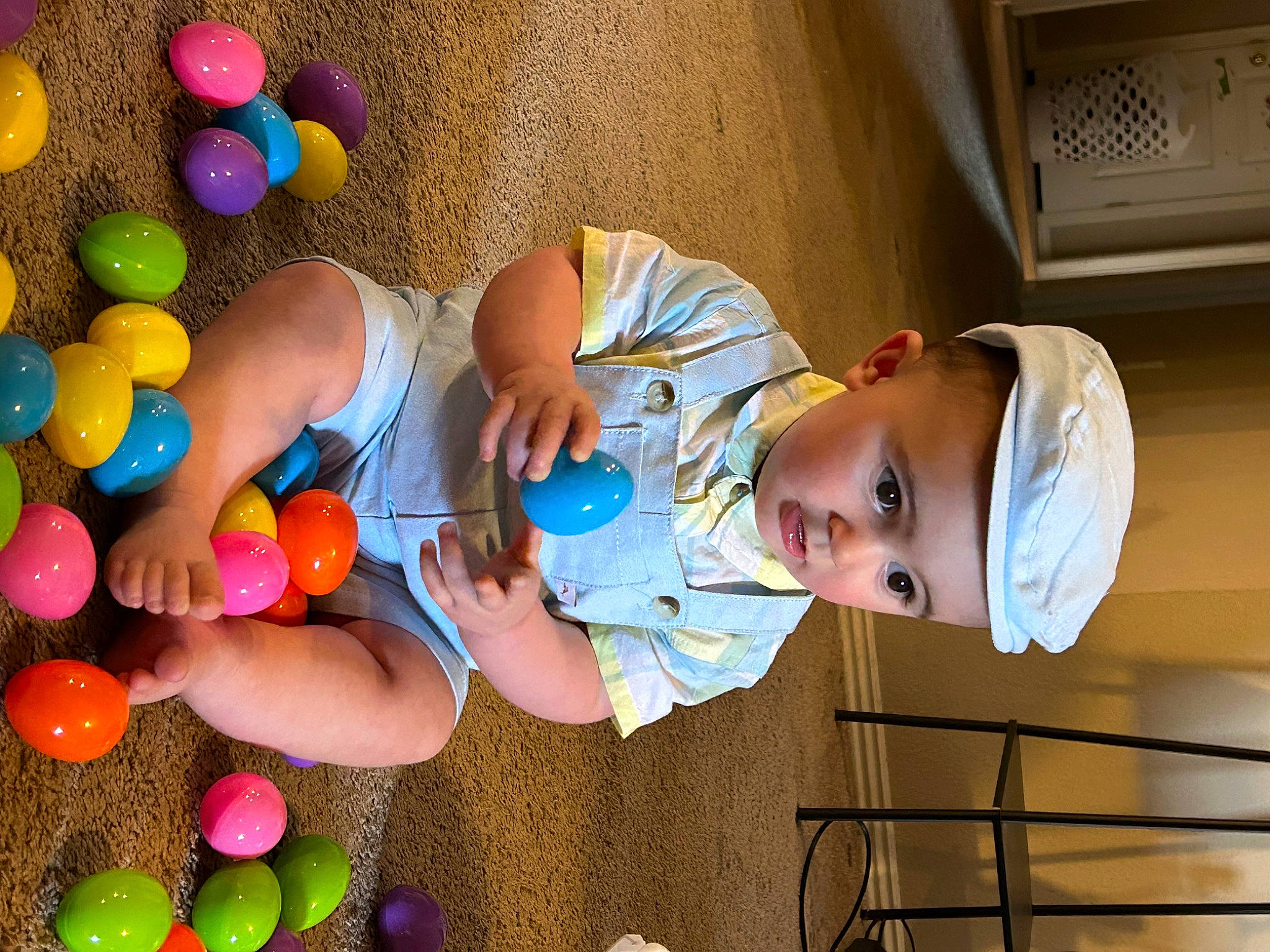 Chrystian is registered to the contest to win money with this photo: baby, baby_products, baby_toddler_clothing, balloon, child, event, facial_expression, fun, hand, happy, hat, headwear, leisure, party_supply, people, person, play, product, room, snapshot