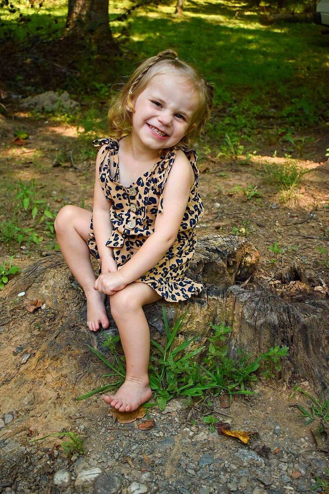 Blakeleigh is registered to the contest to win money with this photo: arm, eye, face, fawn, flash_photography, grass, hair, hand, happy, head, human_body, joy, leaf, leg, mammal, people_in_nature, person, plant, skin, smile