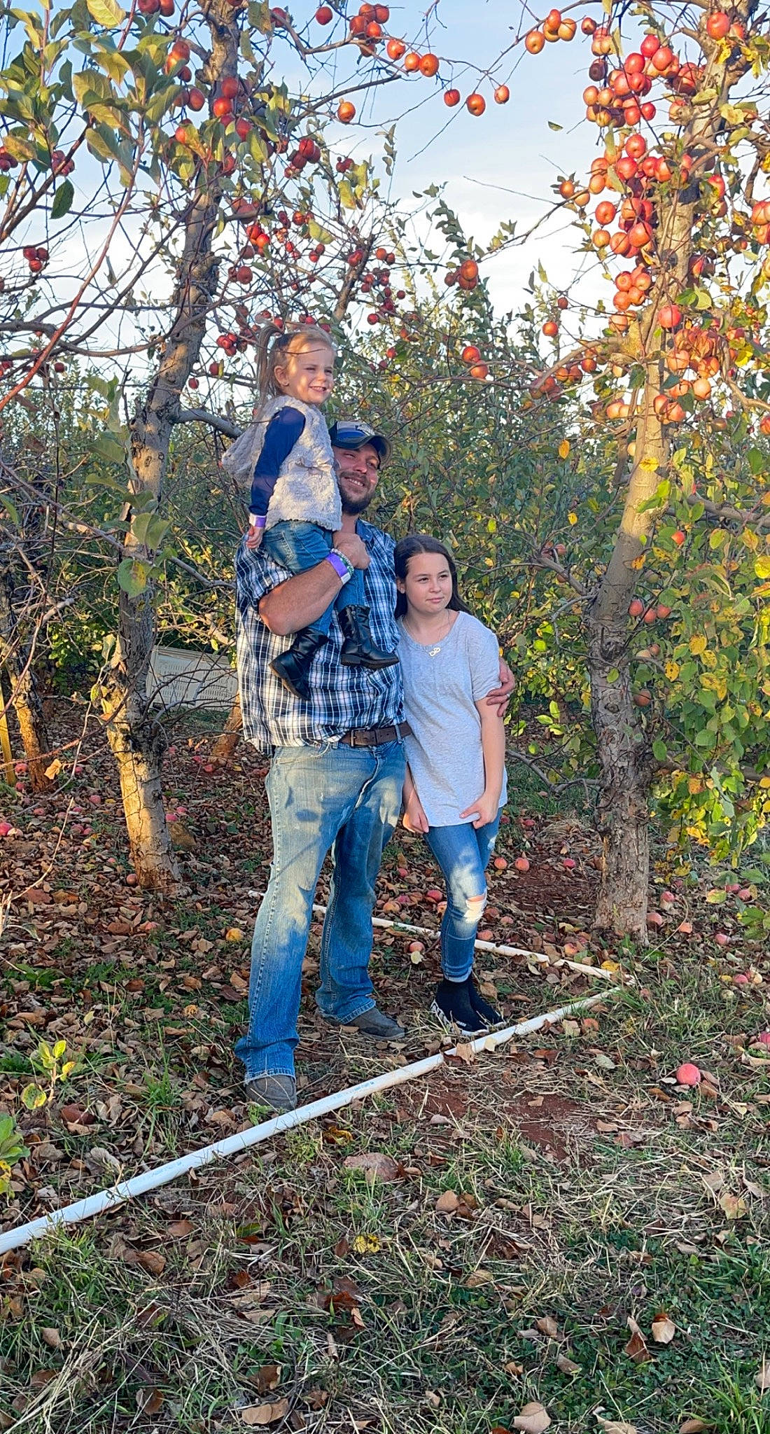 Blakeleigh is registered to the contest to win money with this photo: branch, deciduous, denim, electric_blue, forest, grass, headwear, jeans, joy, leisure, natural_landscape, northern_hardwood_forest, people_in_nature, person, plant, recreation, sky, temperate_broadleaf_and_mixed_forest, tree, twig