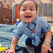 Gurnawab joined the competition — help win amazing prizes! baby, child, crawling, smiling, blue_shirt, tie, bedspread, indoor, patterned, happy, cute, person, home, tiles, toy, bracelet, face, infant, young_child, playful