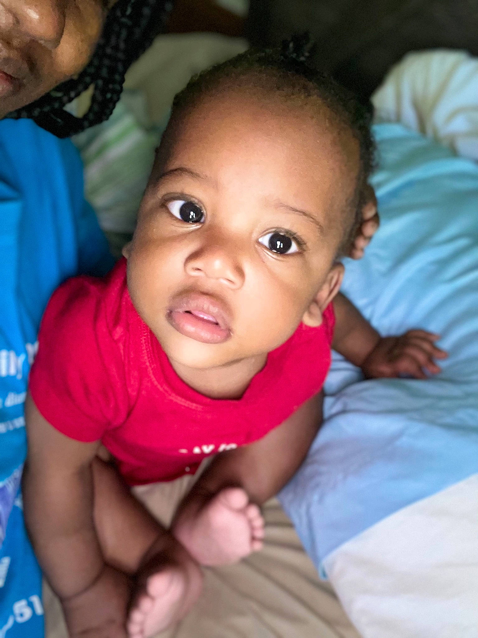 Chase is registered to the contest to win money with this photo: baby, black, cheek, chin, ear, eyebrow, finger, forehead, gesture, hair, hairstyle, hand, happy, iris, lip, mammal, mouth, nose, person, skin