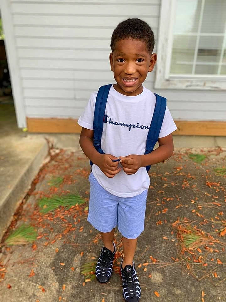 Jaylon is registered to the contest to win money with this photo: child, door, electric_blue, fun, grass, happy, head, joy, knee, leisure, person, recreation, shorts, shoulder, sleeve, smile, sportswear, street_fashion, t_shirt, toddler
