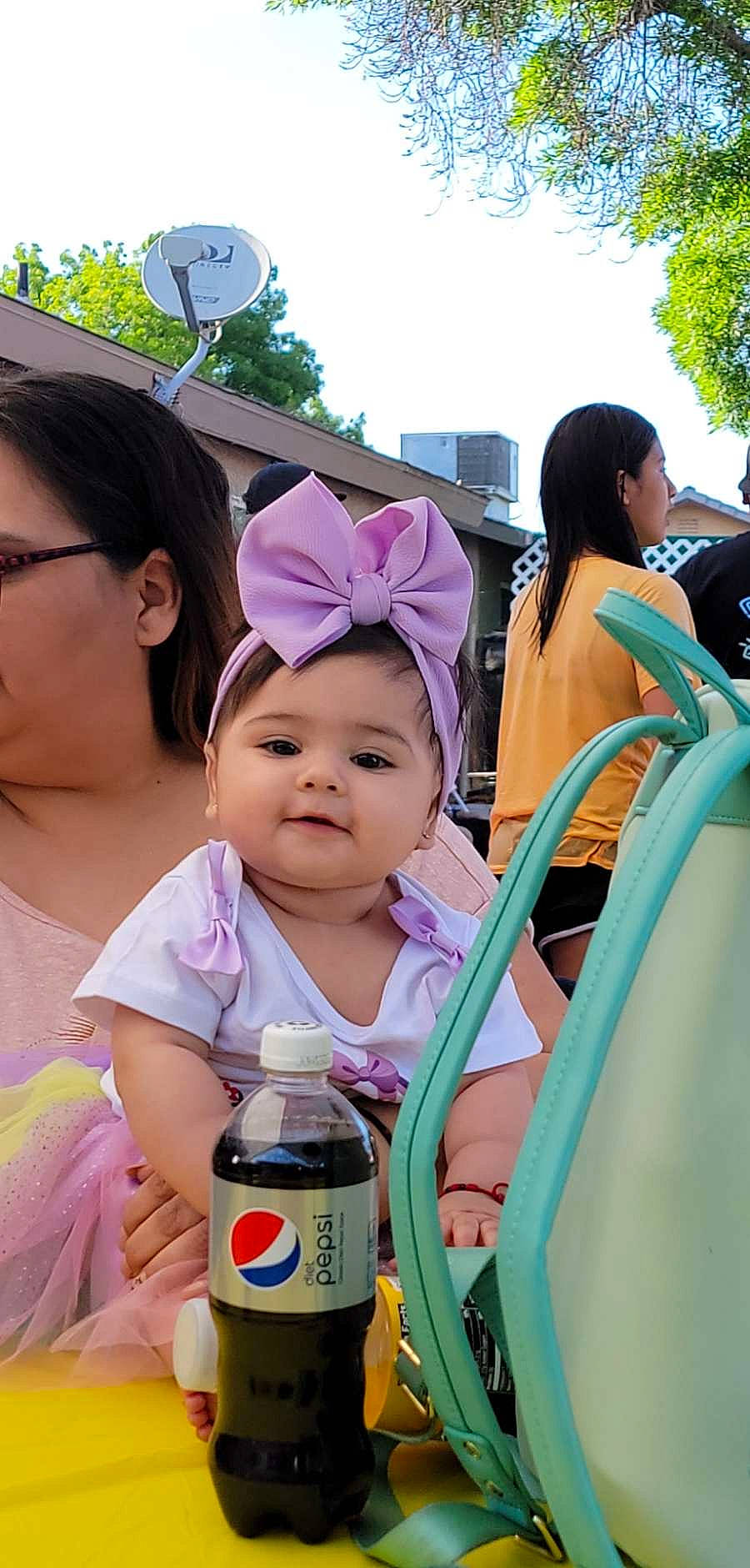 Enalise is registered to the contest to win money with this photo: baby, baseball_cap, bottle, cap, child, event, fun, happy, hat, headwear, leisure, organ, person, pink, plant, plastic_bottle, purple, recreation, skin, toddler