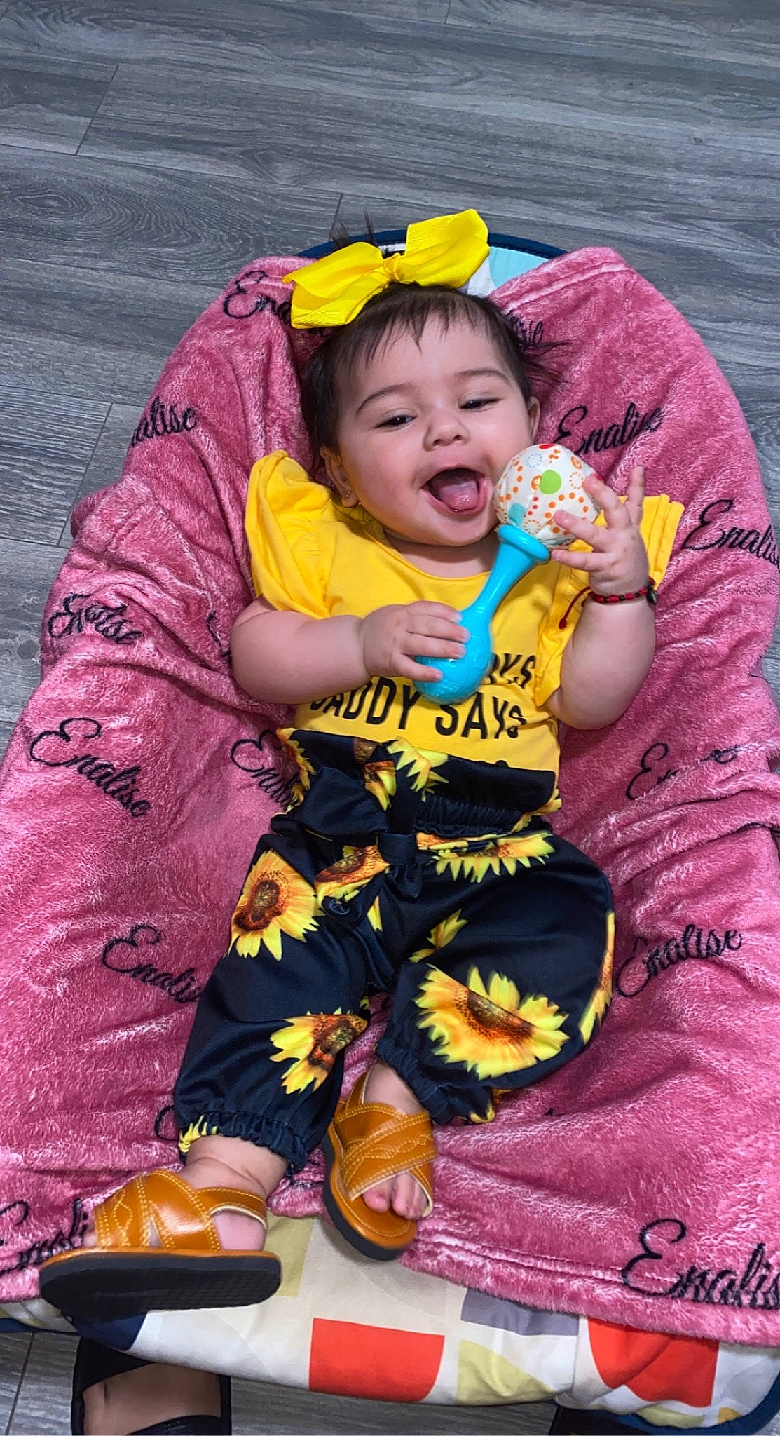 Enalise joined the competition — help win amazing prizes! baby, baby_toddler_clothing, beauty, child, eye, face, fun, grass, happy, head, outerwear, people_in_nature, person, pink, plant, purple, sitting, skin, toddler, water