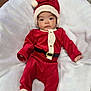 baby, child, santa_claus_costume, red_clothing, hat, infant, blanket, white_background, cute, holiday, festive, portrait, indoors, soft_texture, face, one_person, young_child, costume, christmas, lying_down