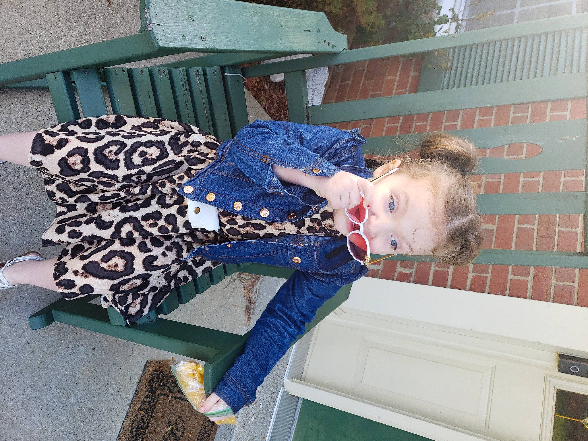 Armani is registered to the contest to win money with this photo: child, comfort, electric_blue, fun, human_leg, lap, leisure, outdoor_furniture, person, sitting, thigh