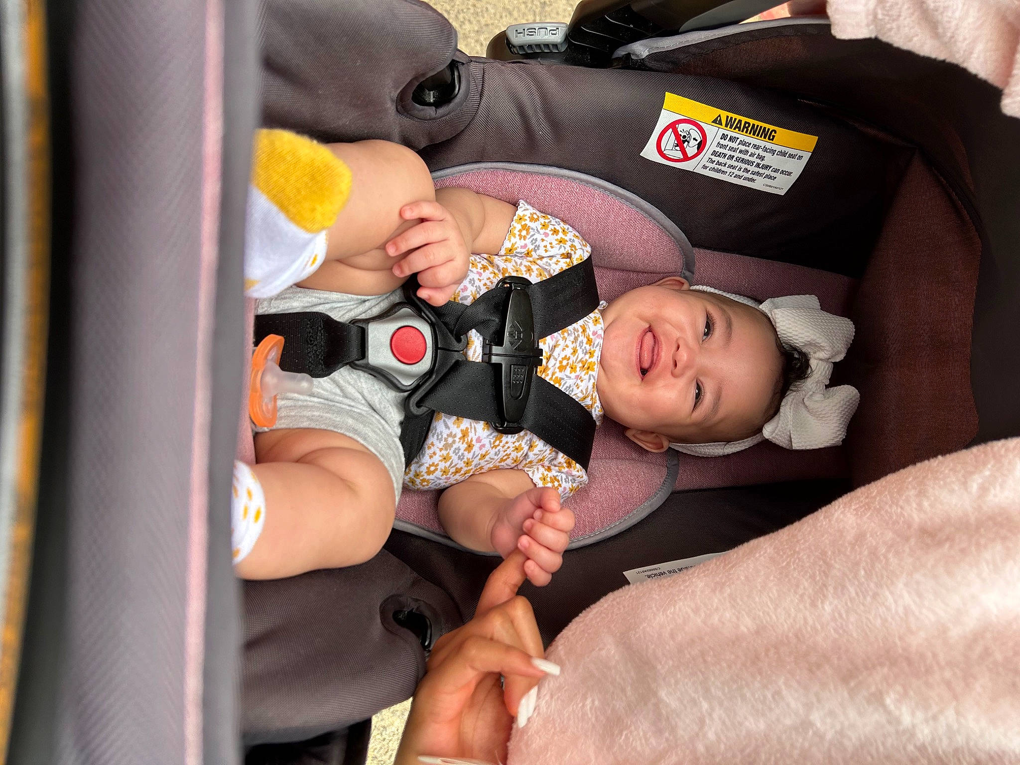 Amiyah is registered to the contest to win money with this photo: baby, baby_carriage, baby_products, baby_safety, baby_toddler_clothing, car_seat, child, comfort, event, fun, gesture, happy, joy, lap, leg, person, sitting, thigh, toddler, wrist