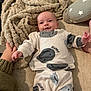 Onnie-Clay joined the competition — help win amazing prizes! baby, infant, smiling, pajamas, blanket, cushion, star_pattern, hand, cozy, comfortable, indoor, soft_texture, person, child, lying_down, cute, warm, relaxed, face, apparel