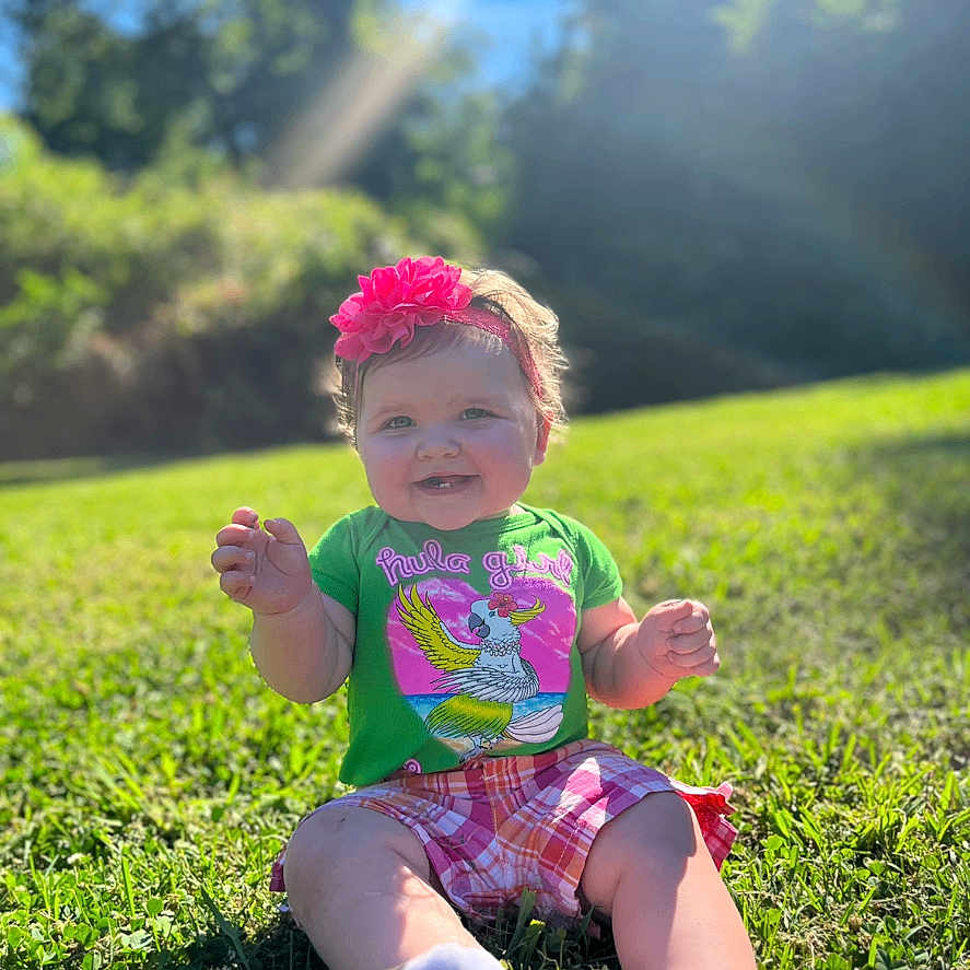 Arabella joined the competition — help win amazing prizes! bodypart, clothing, face, field, finger, grass, grassland, hand, head, lawn, nature, outdoors, park, person, photography, plant, portrait, shorts, summer, t_shirt