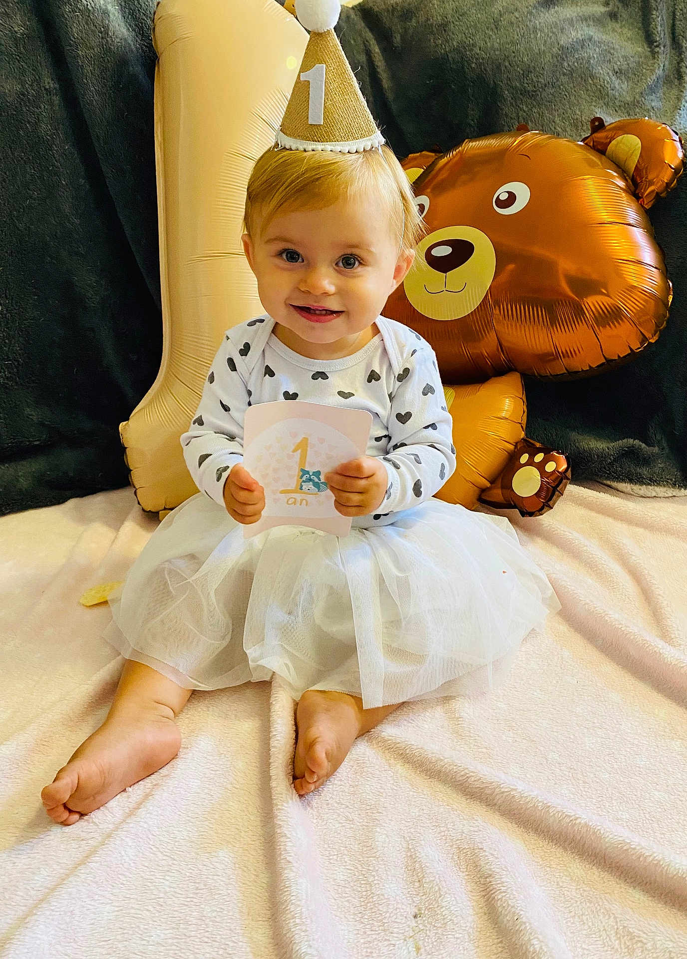 Harper participe au concours pour gagner de l'argent avec cette photo : baby, ball, clothing, costume, dress, face, football, furniture, happy, hat, head, pants, partyhat, people, person, photography, portrait, sitting, sleeve, smile