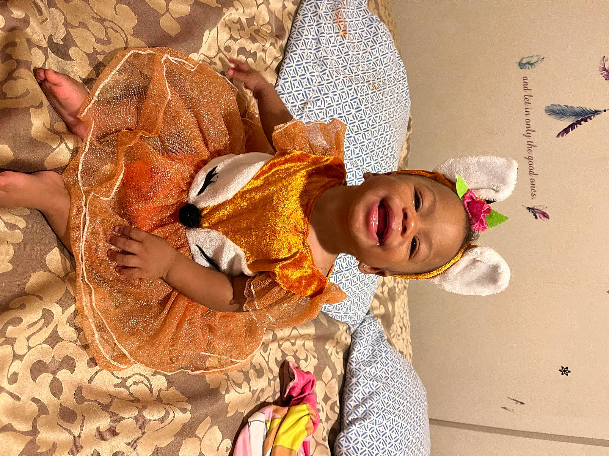 Lily is registered to the contest to win money with this photo: adaptation, art, baby, child, comfort, event, fawn, fun, fur, happy, hat, headgear, linens, organism, pattern, person, room, smile, toddler, tradition