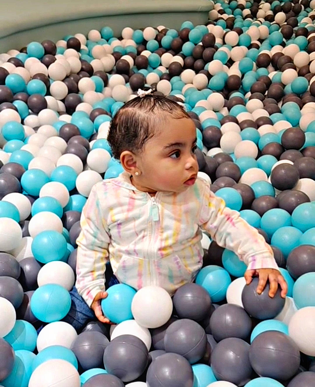 Ame'Ya is registered to the contest to win money with this photo: aqua, azure, baby, baby_toddler_clothing, ball, ball_pit, beauty, child, eye, facial_expression, fun, happy, leisure, people, people_in_nature, person, photograph, product, snapshot, toddler