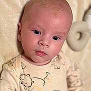 Jaxxon joined the competition — help win amazing prizes! baby, infant, face, eyes, onesie, cartoon_animals, bear, dog, soft_texture, beige, closeup, portrait, child, cute, sleepwear, newborn, skin, head, expression, lying_down