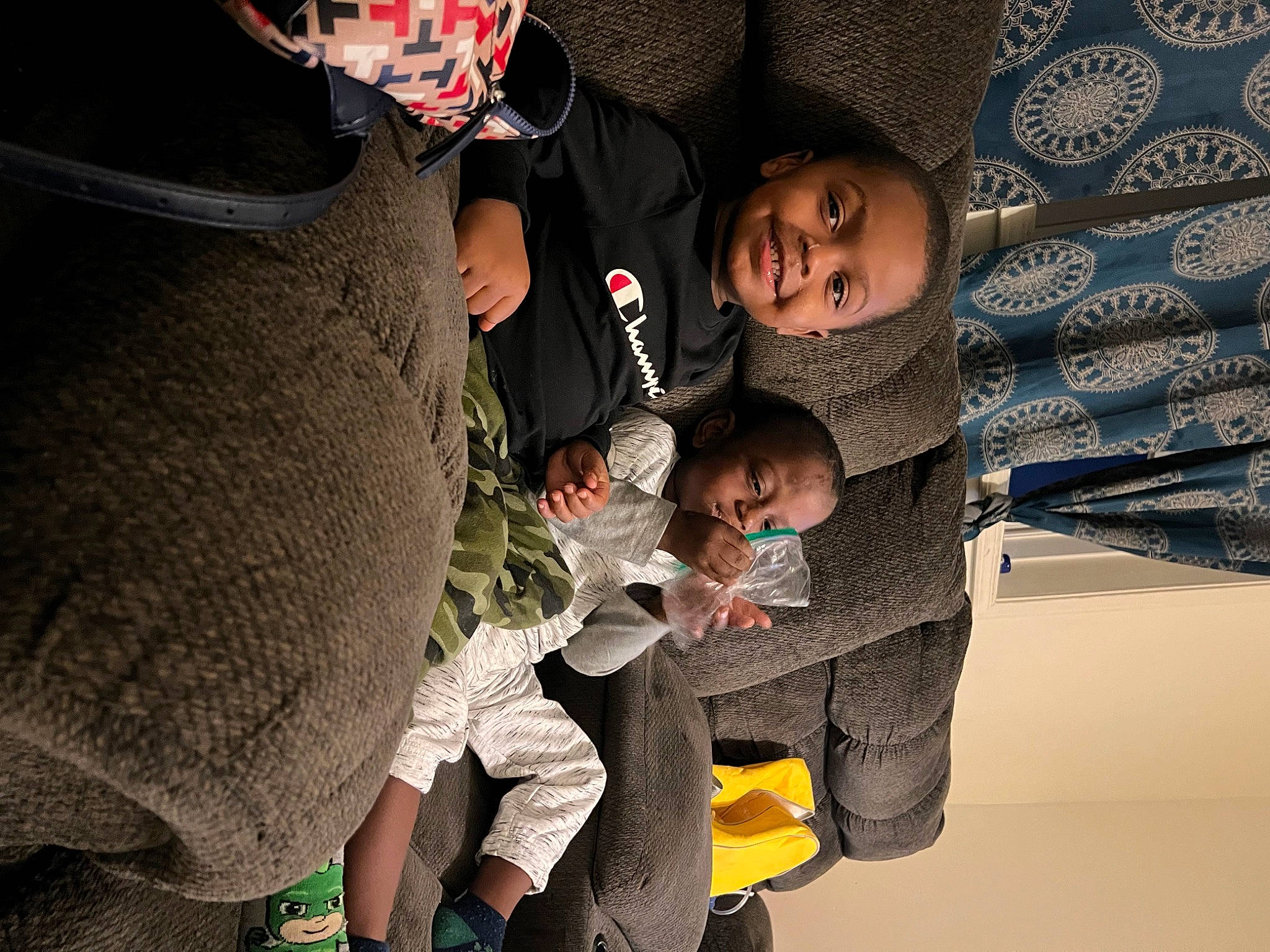 Antwan is registered to the contest to win money with this photo: baby, child, event, flash_photography, fun, happy, joy, leisure, organism, pattern, person, room, sitting, space, t_shirt, toddler, tree, world