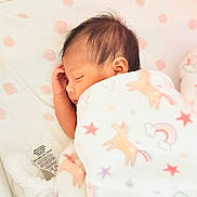 Makeda is registered to the contest to win money with this photo: baby, sleeping, blanket, unicorn, stars, rainbow, bassinet, infant, soft, cozy, cute, child, peaceful, resting, pajamas, newborn, comfort, face, hand, hair