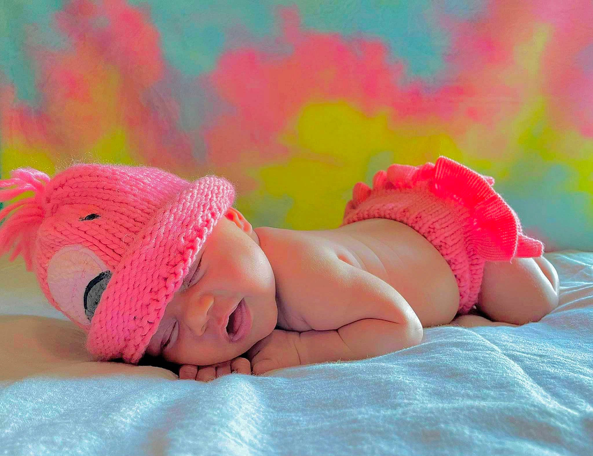 Riah joined the competition — help win amazing prizes! abdomen, baby, cap, child, comfort, fashion_accessory, finger, grass, happy, headgear, headwear, human_leg, knee, linens, magenta, orange, pattern, person, pink, thigh