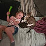 Oaklynn joined the competition — help win amazing prizes! child, toy, cat, bed, pillow, blanket, couch, indoor, person, pet, animal, feline, cute, smile, happy, cozy, home, casual, relaxed, friendship