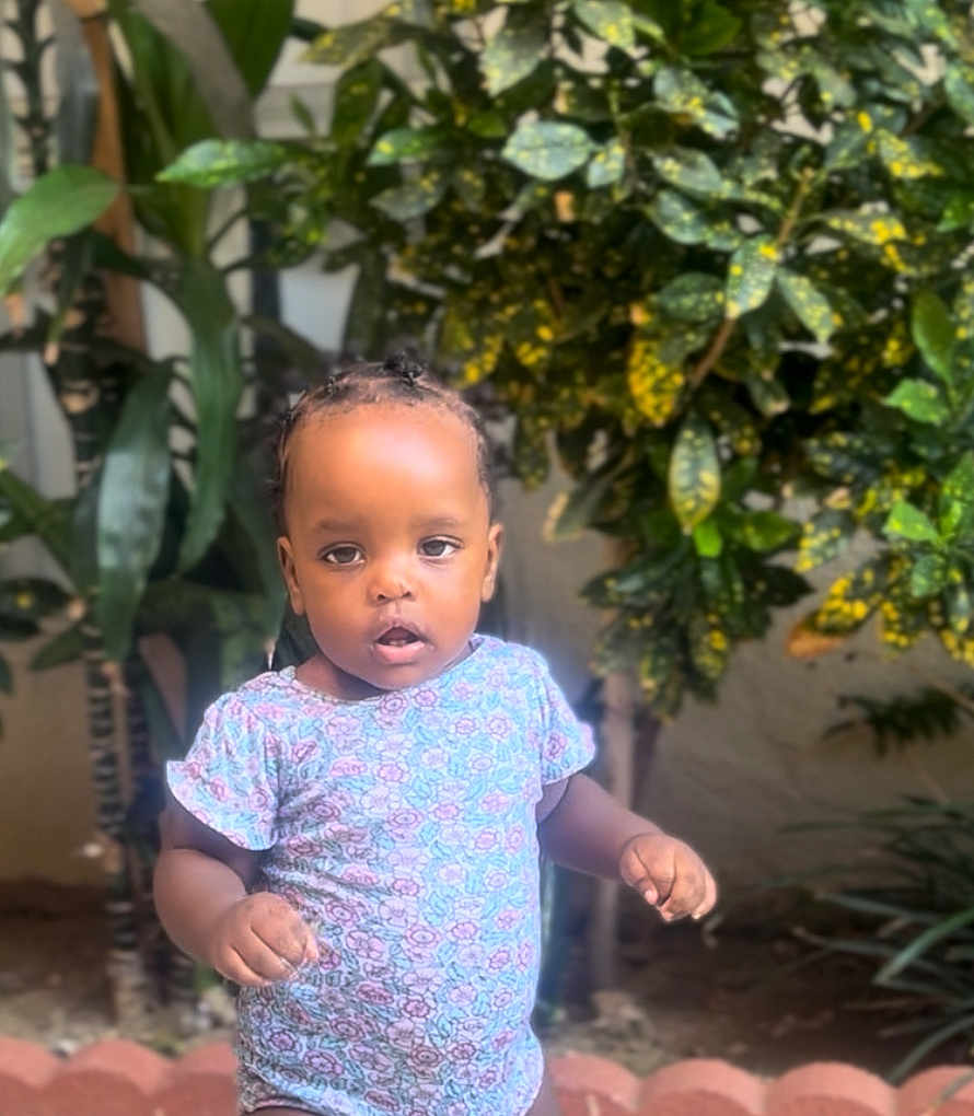 Shezlin joined the competition — help win amazing prizes! toddler, child, outdoor, greenery, plants, leafy, nature, portrait, cute, young_child, floral_shirt, standing, expression, face, person, baby, curious, daylight, garden, casual_clothing