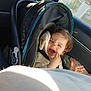 Cersei is registered to the contest to win money with this photo: car_interior, car_seat, child, clothing, darth_vader, daylight, earrings, expression, face, hair, hand, person, seatbelt, skin, sticker, sunlight, toddler, transportation, vehicle, window