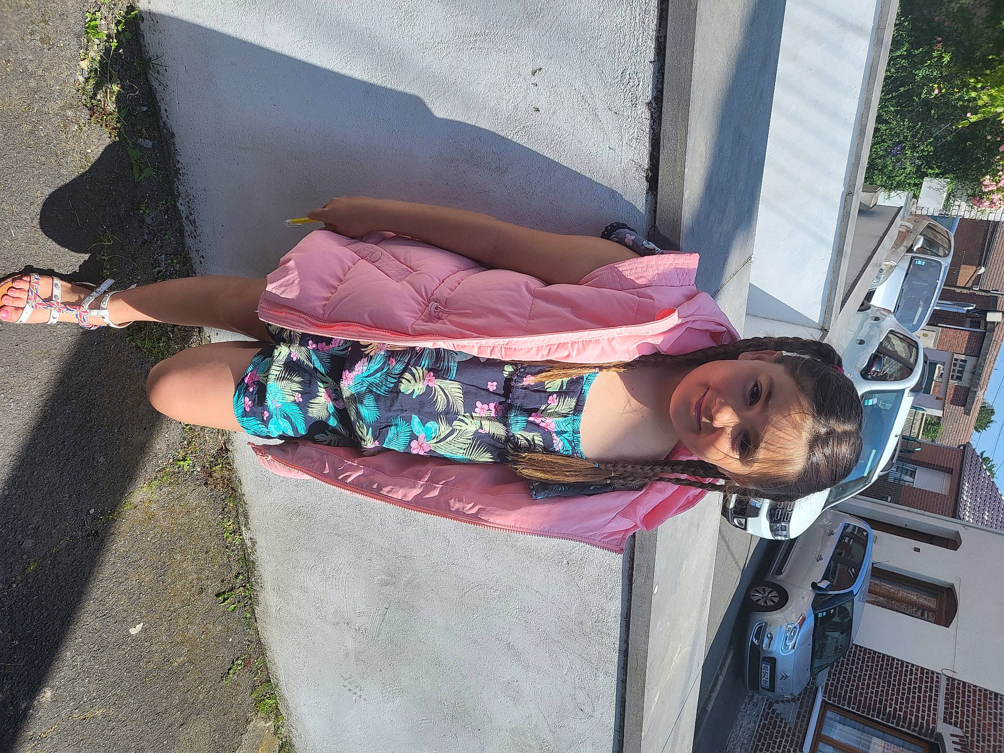 Kieira participe au concours pour gagner de l'argent avec cette photo : asphalt, child, city, concrete, fun, human_leg, joy, leisure, magenta, person, pink, road_surface, sandal, sidewalk, sitting, street, toddler, tree, vacation