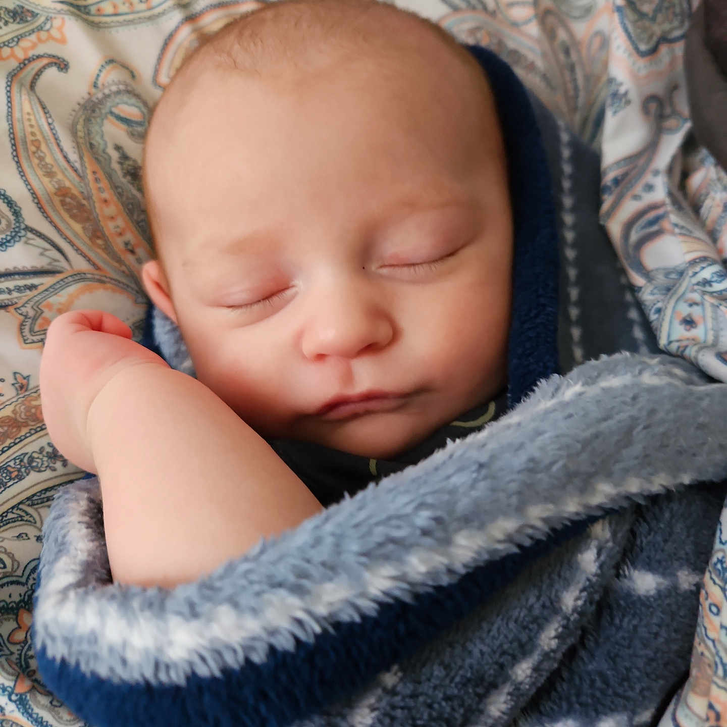 Dwayne joined the competition — help win amazing prizes! baby, blanket, bodypart, clothing, face, finger, hand, hat, head, hood, hoodie, knitwear, newborn, person, photography, portrait, quilt, sweater, sweatshirt, towel