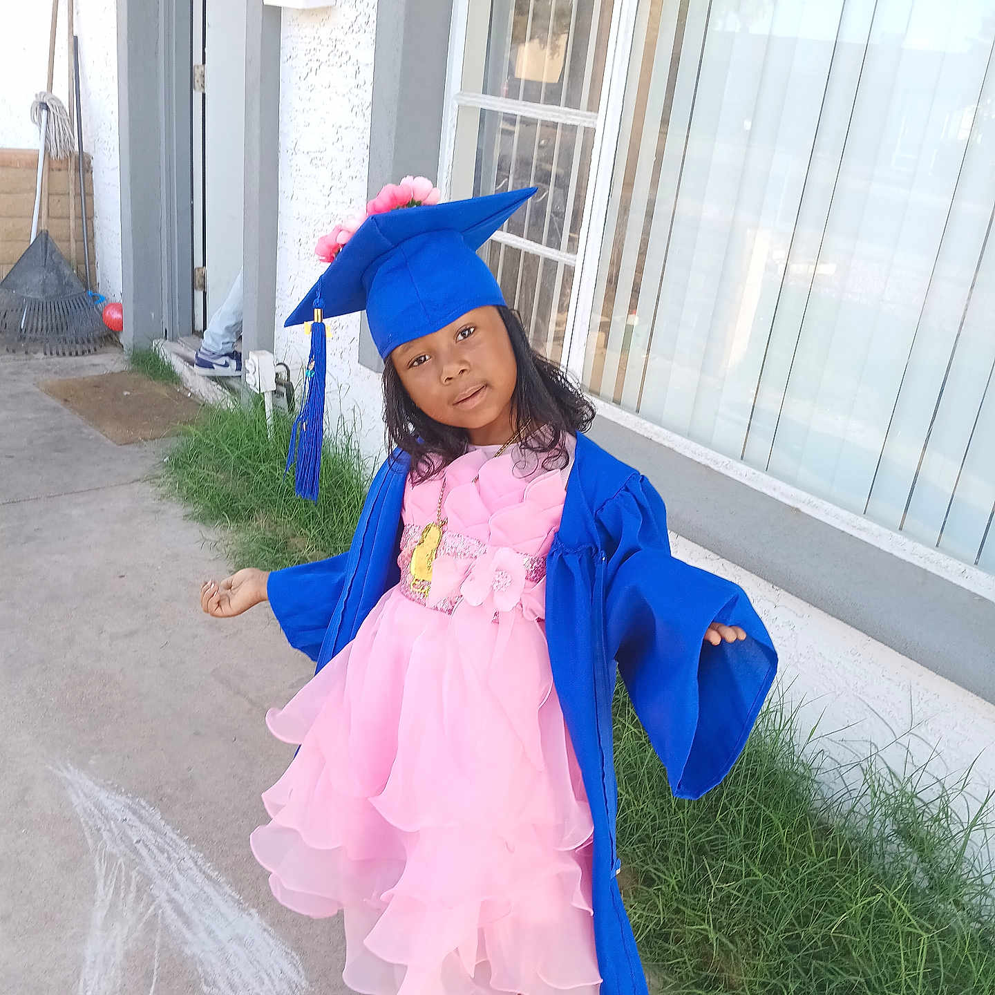 Elajha is registered to the contest to win money with this photo: architecture, building, child, clothing, costume, dress, face, female, girl, graduation, head, outdoors, path, people, person, photography, portrait, purple, shelter, student