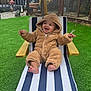 Ziggy joined the competition — help win amazing prizes! baby, child, smile, outdoor, lounge_chair, umbrella, striped, green_grass, happy, cozy_clothing, onesie, fence, garden, toes, wooden_armrest, cute, infant, playful, relaxing, hooded